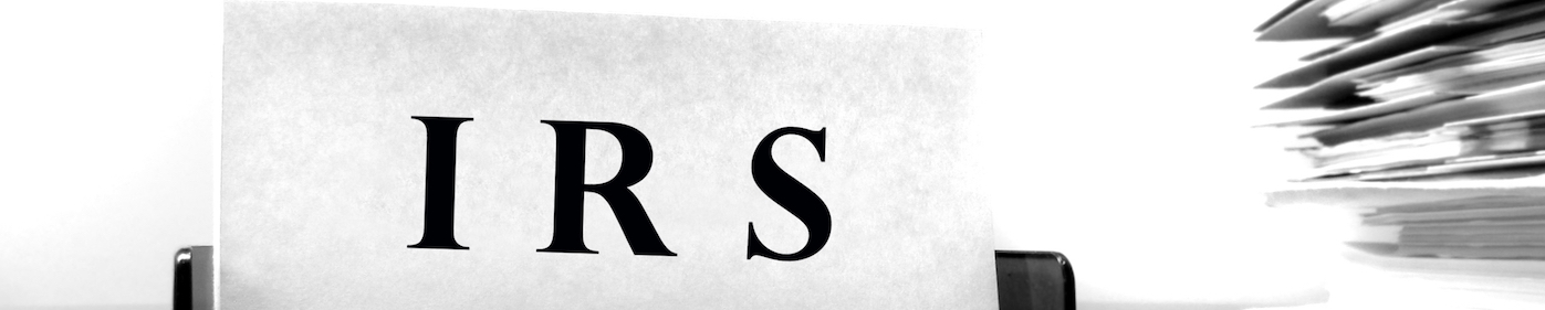 Word "IRS" on placard